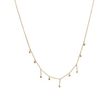 Our AURA NECKLACE features dangly cubic zirconia (CZ) stones and is the perfect necklace stack addition. It's simple with just the right amount of glam. It's stackable, but looks just as good worn on its own.  18k gold plated on stainless steel. Length: 16” Extender: 2” All the necklaces come in a beautiful jewelry box.