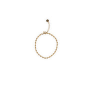 The timeless appeal of our Dainty Bean Design Gold Bracelet makes it a true investment piece. Its classic and versatile design ensures that it will never go out of style, allowing you to enjoy its elegance for years to come. This bracelet is a beautiful addition to any jewelry collection and can be worn alone or layered with other bracelets for a personalized look.  18K gold plated on stainless steel. All the bracelets come in a beautiful jewelry pouch.