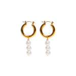 Look at these BEEauties! Our BEE HOOP EARRINGS are fun, fresh and for anyone who likes to think outside of the box. These earrings feature a small gold hoop with dangly pearls. Need we say more?  18k gold plated on stainless steel. Hoop size: 23mm All the earrings come in a beautiful jewelry pouch.