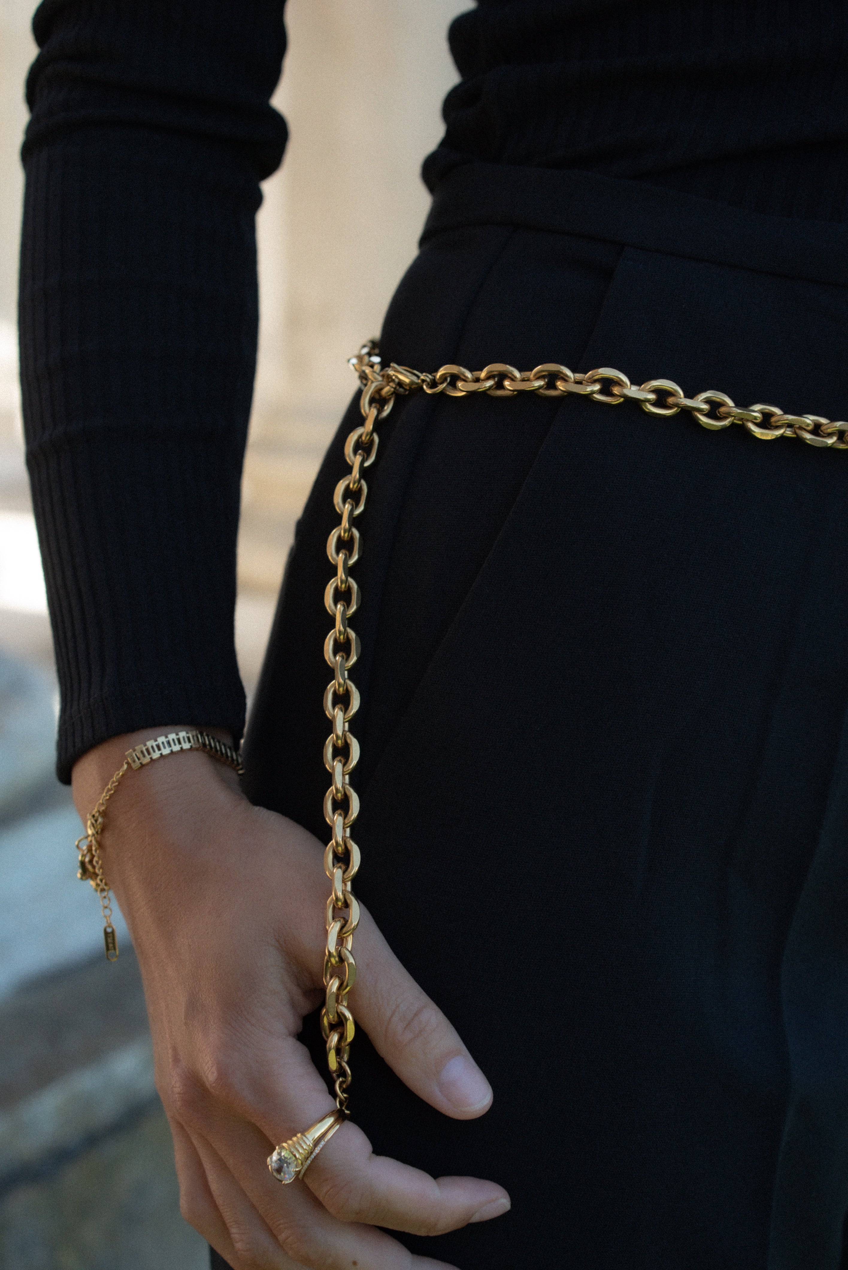 Merci beaucoup! We love our newest body chain accessory. Our chunky MERCI BELT CHAIN can be looped through belt loops on jeans, worn over a dress, skirts, trousers, the possibilities are endless. Make a statement in this versatile piece.  18K gold plated on stainless steel. Length:41" Extender: 6"  It can be hooked anywhere in the links you can adjust the length as you like.